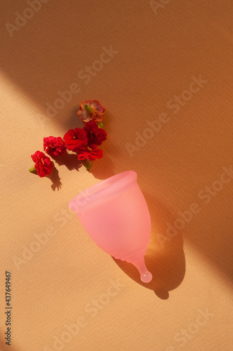 Menstrual cups minimalistic sunny image flat lay top view background with copy space photo