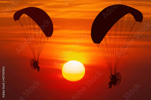 silhouette paramotor at sunset