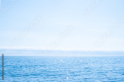 Beautiful blue sparkling Black sea,sky, horizon and clouds in sunny weather. Russian coast