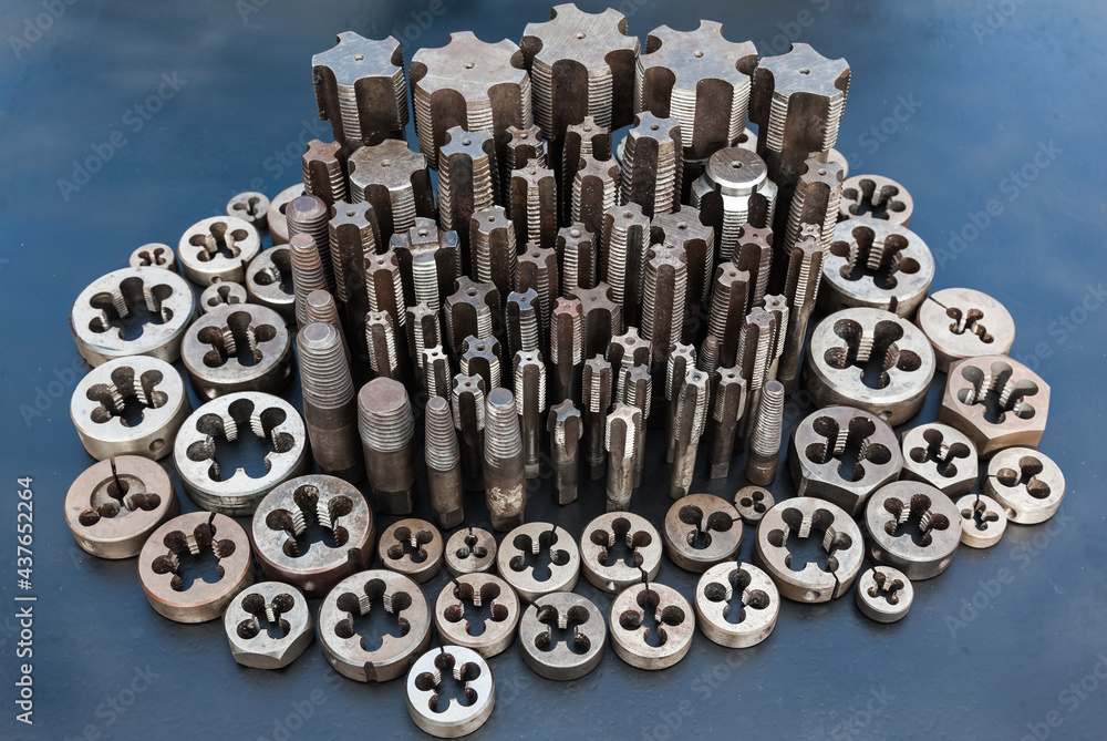 Taps and dies for metal threading. Tools for cutting external and