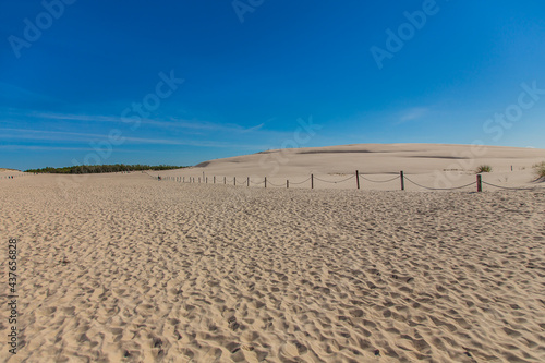 Dunes in the Slowinski National Park. Landscape with beautiful sky, clouds and dunes in the sun in Leba.