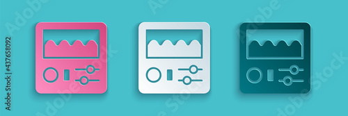 Paper cut Drum machine icon isolated on blue background. Musical equipment. Paper art style. Vector