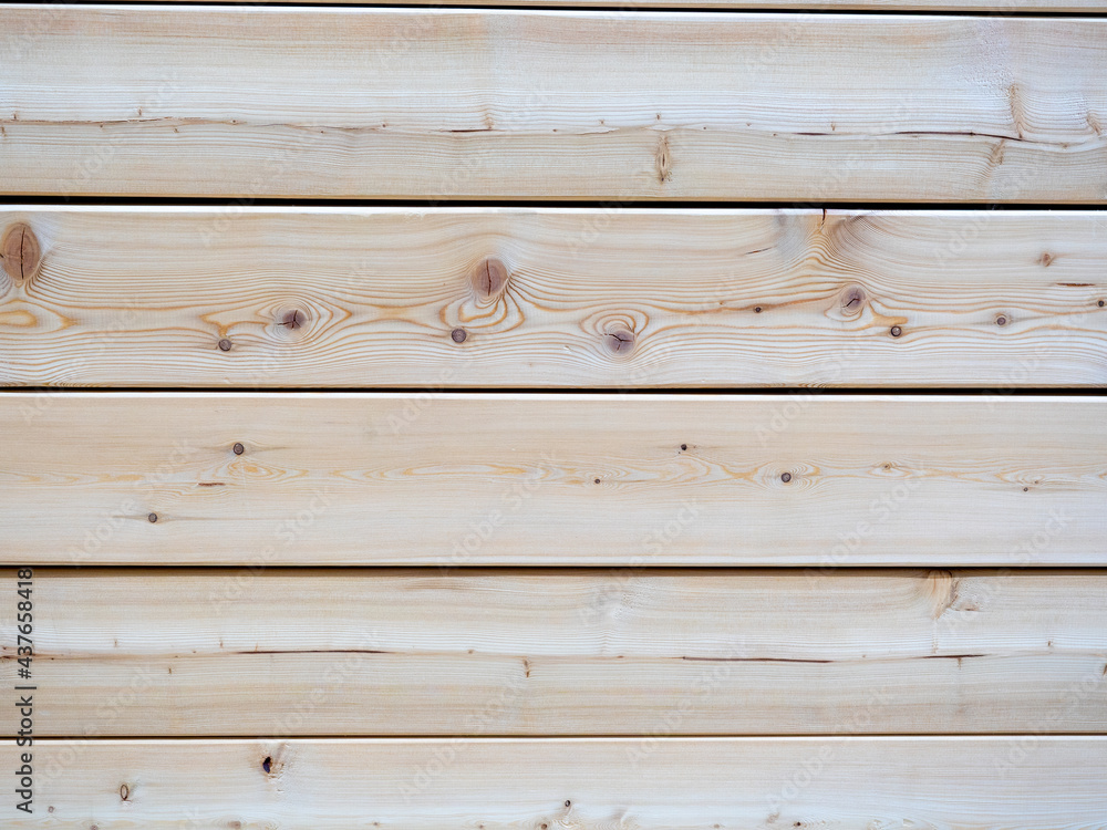 close-up of a clapboard wall. Treated wood, horizontal lines. It can be used as a wooden background for inscriptions close-up of a clapboard wall. Treated wood, horizontal lines. It can be used as a wooden background for inscriptions