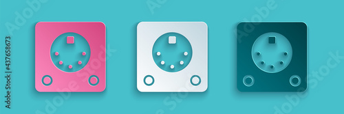 Paper cut Drum machine icon isolated on blue background. Musical equipment. Paper art style. Vector