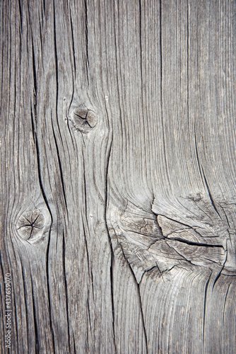 Old wooden background, natural pattern. Dilapidated vertical board, close-up.