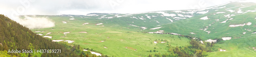Panorama of the Lago-Naki plateau with stripes of winter snow