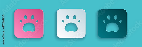 Paper cut Paw print icon isolated on blue background. Dog or cat paw print. Animal track. Paper art style. Vector