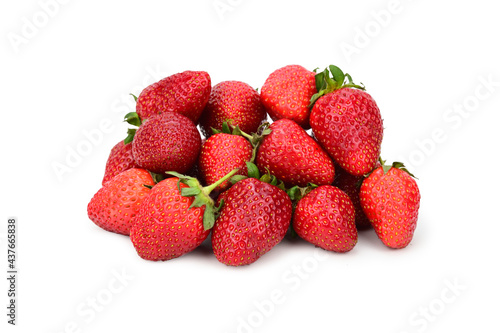 A bunch of ripe strawberries with green caps and cuttings