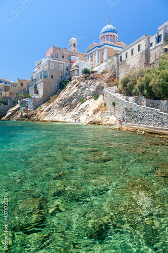 Vaporia district, the most picturesque part of Ermoupoli town, the capital of Syros island, Greece, with its own rocky beach and many old traditional houses, most owned by old captains.  photo