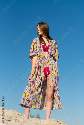 Portrait of Beautiful young woman wearing a colorfull sarong and bikini on the tropical beach