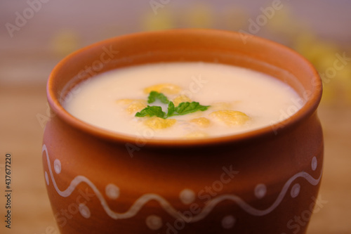 Indian style summer drink masala chach or raita made from buttermilk photo