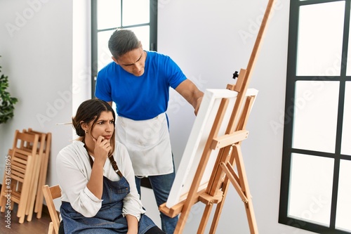 Teacher furious with paint student at art school.
