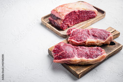 New York steak, raw beef meat , on white background, with copy space for text photo
