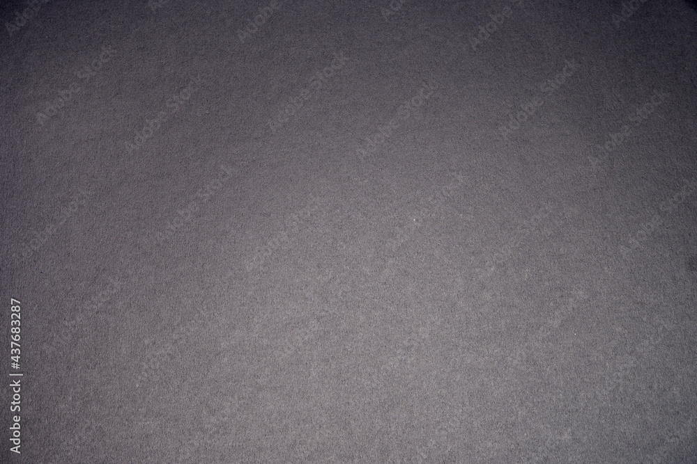 Black background. The texture of the cardboard. Black background. The texture of the cardboard.