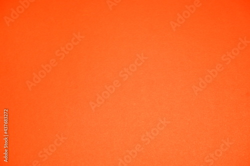 Orange background. The texture of the cardboard.