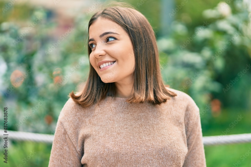 Young hispanic woman smiling happy standing at the city. Young hispanic woman smiling happy standing at the city.