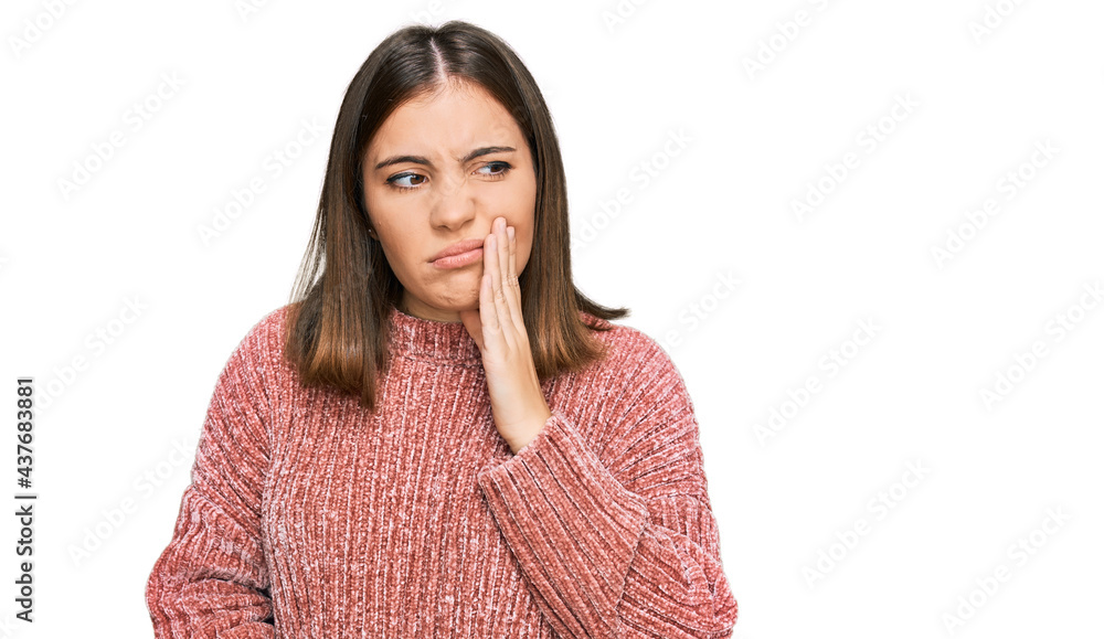 Young beautiful woman wearing casual clothes touching mouth with hand with painful expression because of toothache or dental illness on teeth. dentist Young beautiful woman wearing casual clothes touching mouth with hand with painful expression because of toothache or dental illness on teeth. dentist