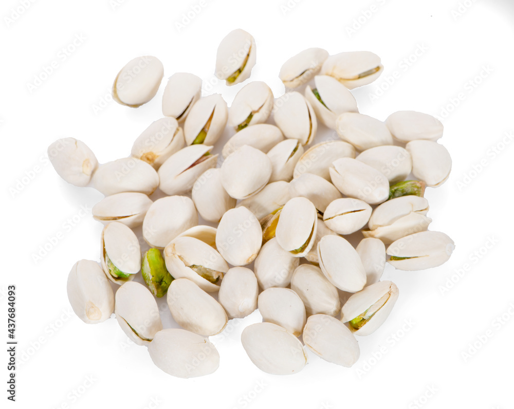 Salted Pistachio nuts in closeup isolated on white background Salted Pistachio nuts in closeup isolated on white background