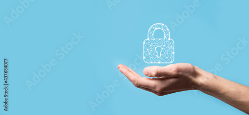 Male hand holding a lock padlock icon.Cyber security network. Internet technology networking.Protecting data personal information on tablet. Data protection privacy concept. GDPR. EU.Banner photo