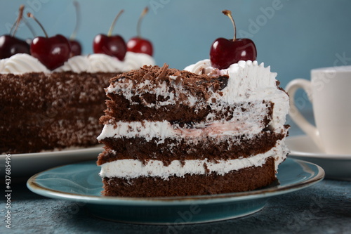 Fototapeta Naklejka Na Ścianę i Meble -  Black forest cake, Schwarzwald pie, dark chocolate and cherry dessert . Black forest cake decorated with whipped cream and cherries.