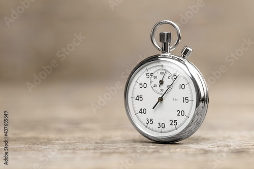 Stopwatch on a wooden background. Template Copy space for text