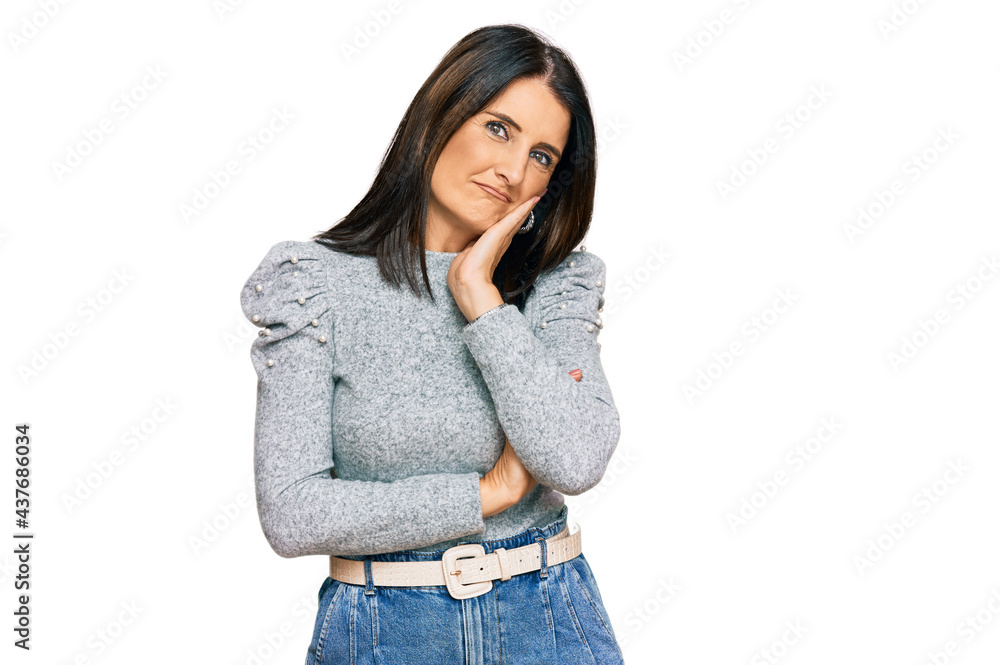 Middle age brunette woman wearing casual clothes thinking looking tired and bored with depression problems with crossed arms. Middle age brunette woman wearing casual clothes thinking looking tired and bored with depression problems with crossed arms.