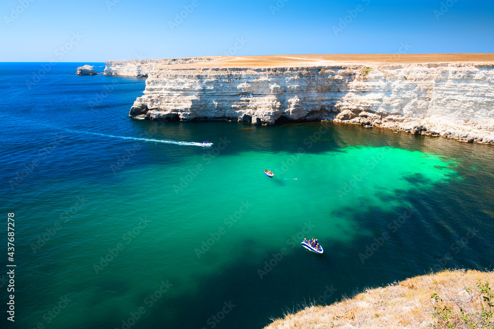 Beautiful sea coast with turquoise water and rocks. Tarhankut Cape, Crimea peninsula. Summer seascape, famous travel destination