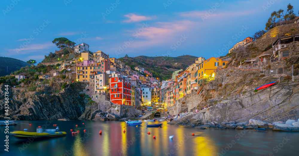 Riomaggiore,  Colorful cityscape on the mountains over Mediterranean sea in Cinque Terre Italy
