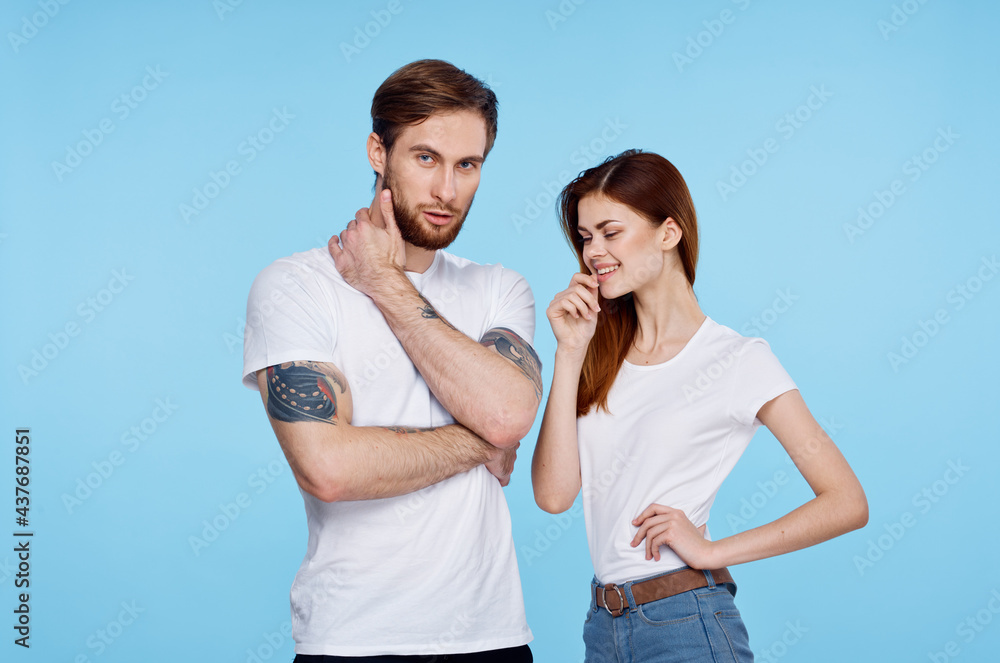 young couple in white t-shirt fashion modern style blue background young couple in white t-shirt fashion modern style blue background