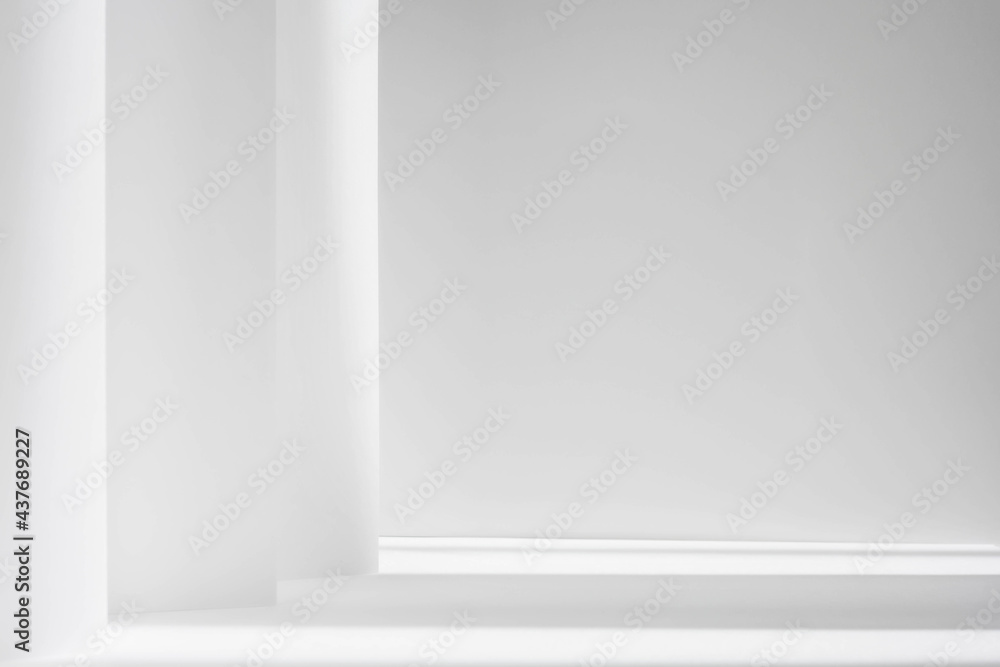 Fototapeta premium Abstract white studio background for product presentation. Empty gray room with shadows of window. Display product with blurred backdrop.