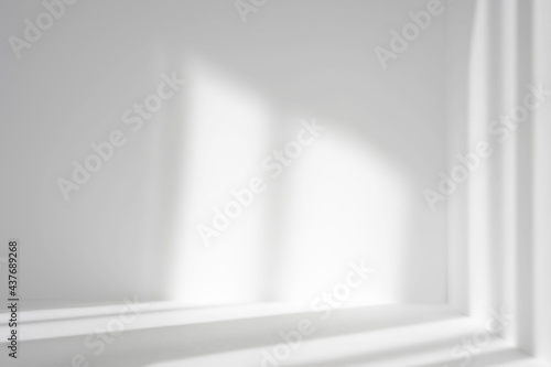Empty white corner. Abstract studio background for product presentation. 3d room with shadows of window. Minimalistic space concept with blurred backdrop.