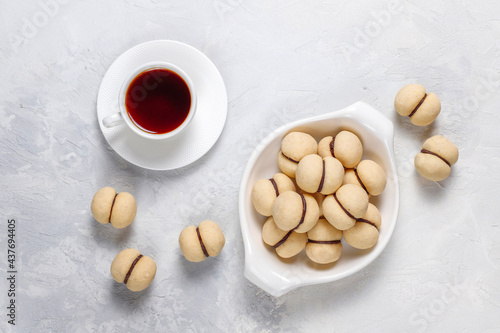 Baci di dama homemade italian hazelnut biscuits cookies with chocolate cream.