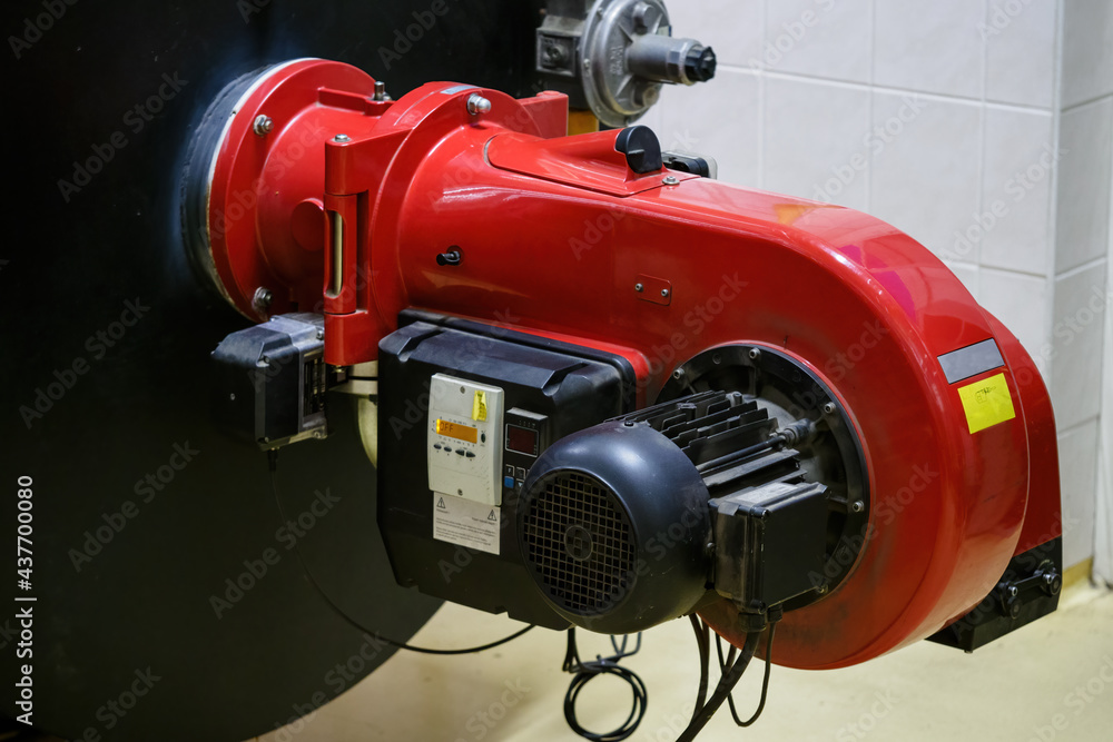 Red industrial gas burner from the boiler. Red industrial gas burner from the boiler.