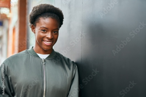 Young african american girl smiling happy standing at the city. © Krakenimages.com