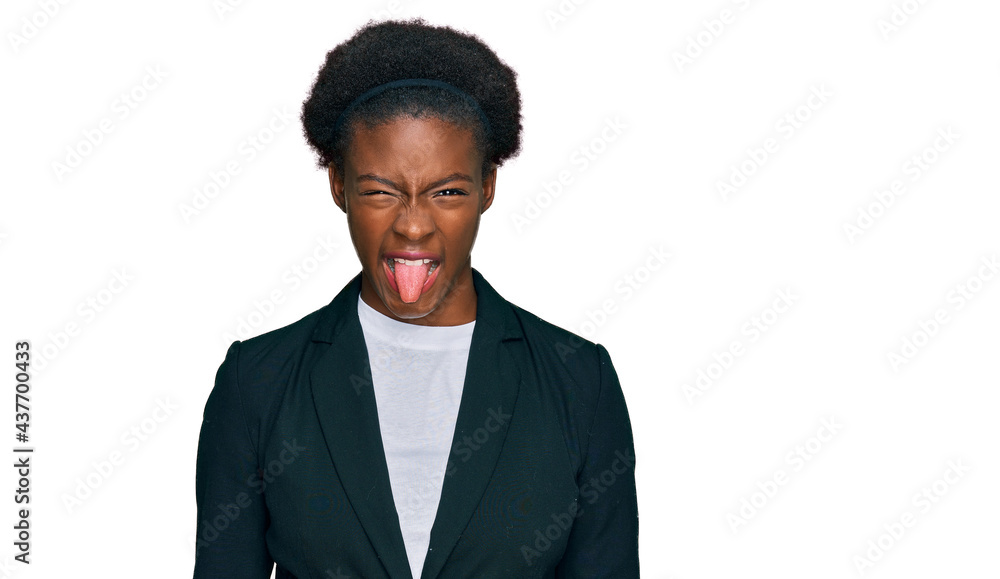 Young african american girl wearing business clothes sticking tongue out happy with funny expression. emotion concept. Young african american girl wearing business clothes sticking tongue out happy with funny expression. emotion concept.