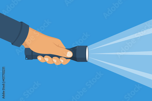 Hand holding flashlight. Search concept. Yellow bright ray of light. Vector illustration flat design. Isolated on white background. Beam light. Press a finger on the button.