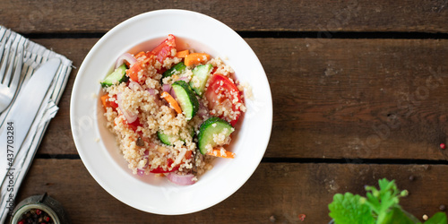 couscous salad tomato, cucumber, spices vegetable appetizer fresh portion organic on the table healthy meal snack copy space food background rustic top view 