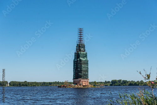 The Bell tower among water. Flooded town of Kalyazin, Russia. Repair, restoration.