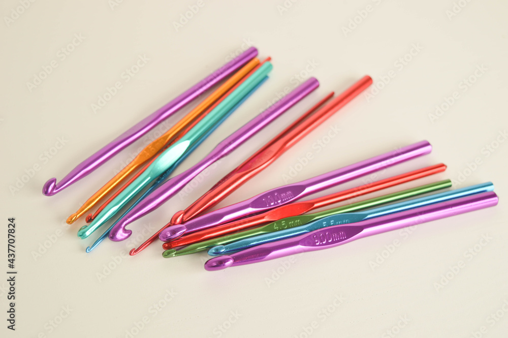 colorful metal crochet hooks close up colorful metal crochet hooks close up
