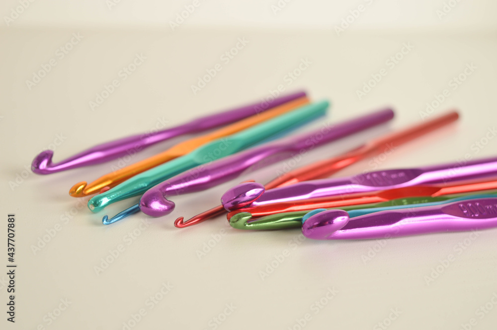 colorful metal crochet hooks close up colorful metal crochet hooks close up