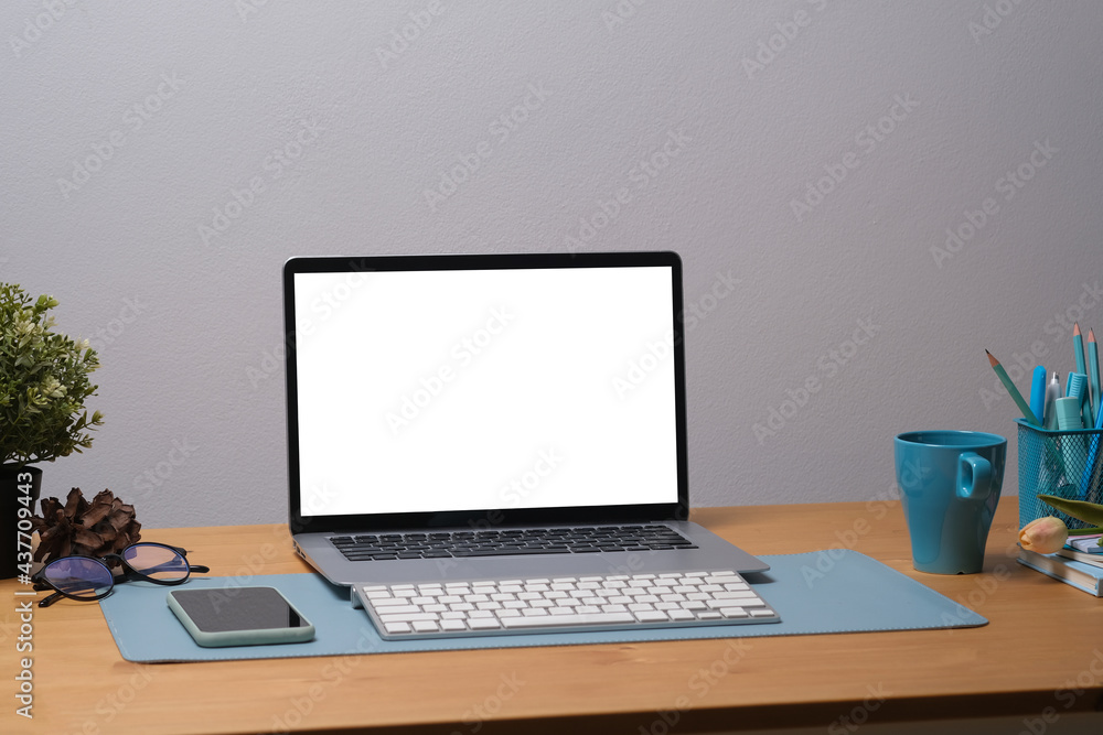 Front view of office desk with write display computer and cup of coffee Front view of office desk with write display computer and cup of coffee