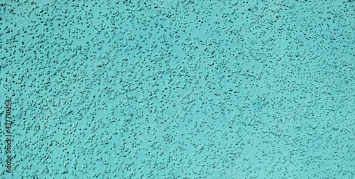 Turquoise old paint on wall surface