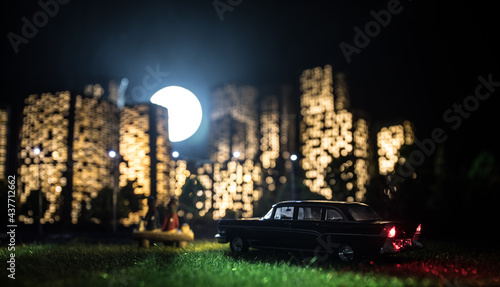 Cartoon style city buildings. Realistic city building miniatures with lights. background.
