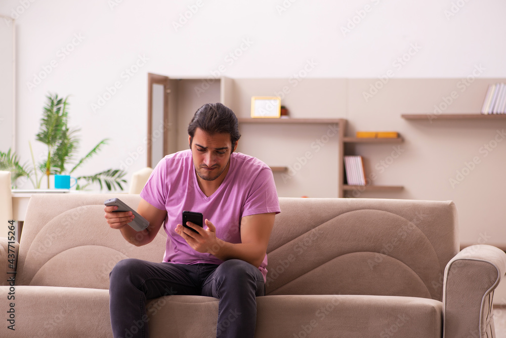 Young man staying at home during pandemic Young man staying at home during pandemic