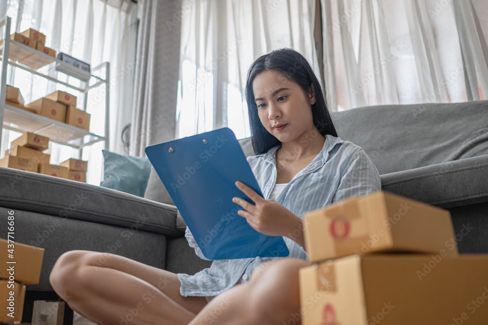 Woman packs and sells products online. Small business. Work from home.sme selling work at home concept. group. Woman packs and sells products online. Small business. Work from home.sme selling work at home concept. group.