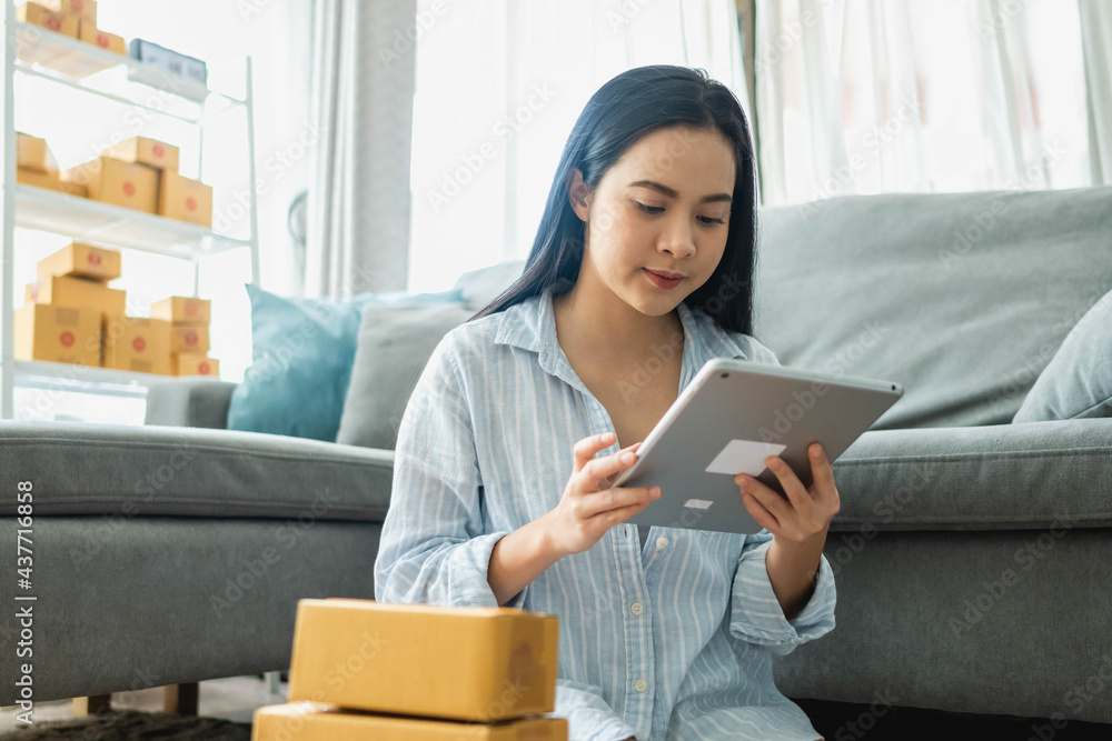 Woman packs and sells products online. Small business. Work from home.sme selling work at home concept. group. Woman packs and sells products online. Small business. Work from home.sme selling work at home concept. group.