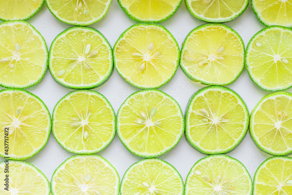 Food background. Sliced lemons neatly laid out on a white background. Suitable for use as a food background or artwork