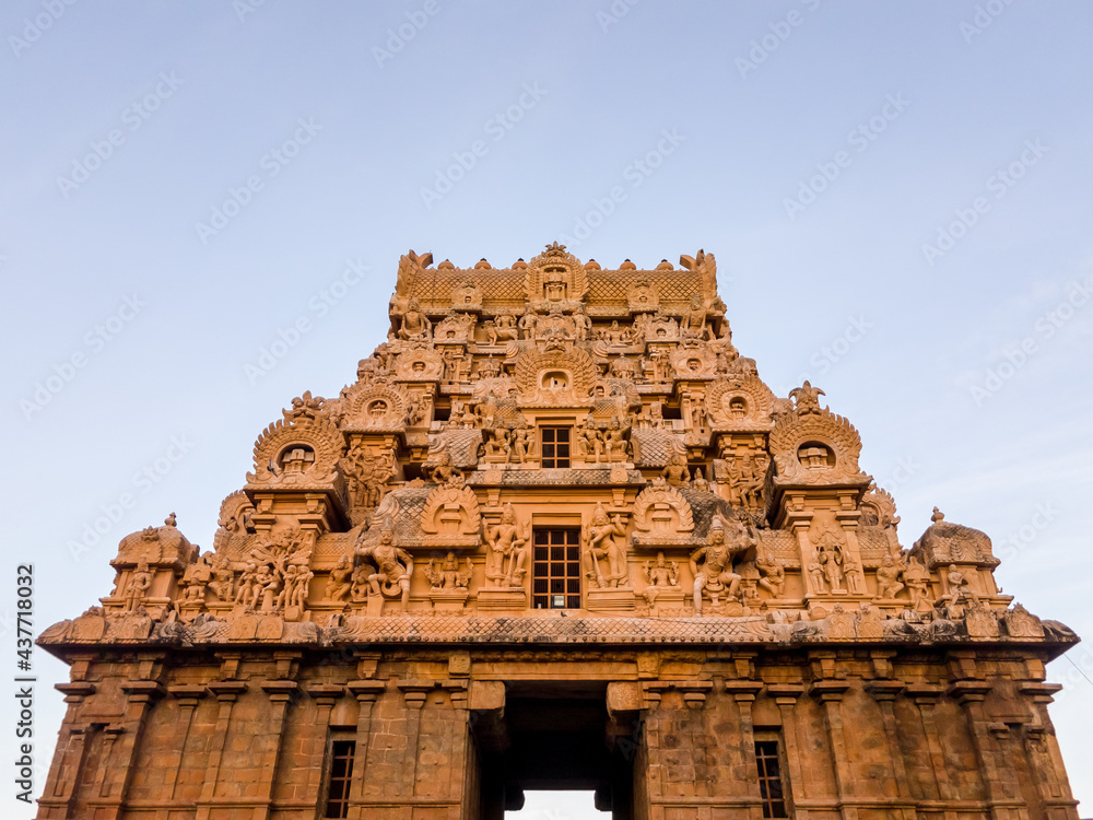 The entrance tower with beautiful carvings of the ancient Hindu temple of Brihadeeshwarar in the town of Thanjavur.