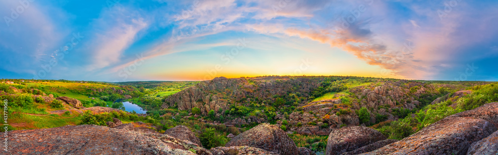 Panoramic landscape of sunset at the Aktovsky canyon on the Mertvovod river. Vivid HDR scenery