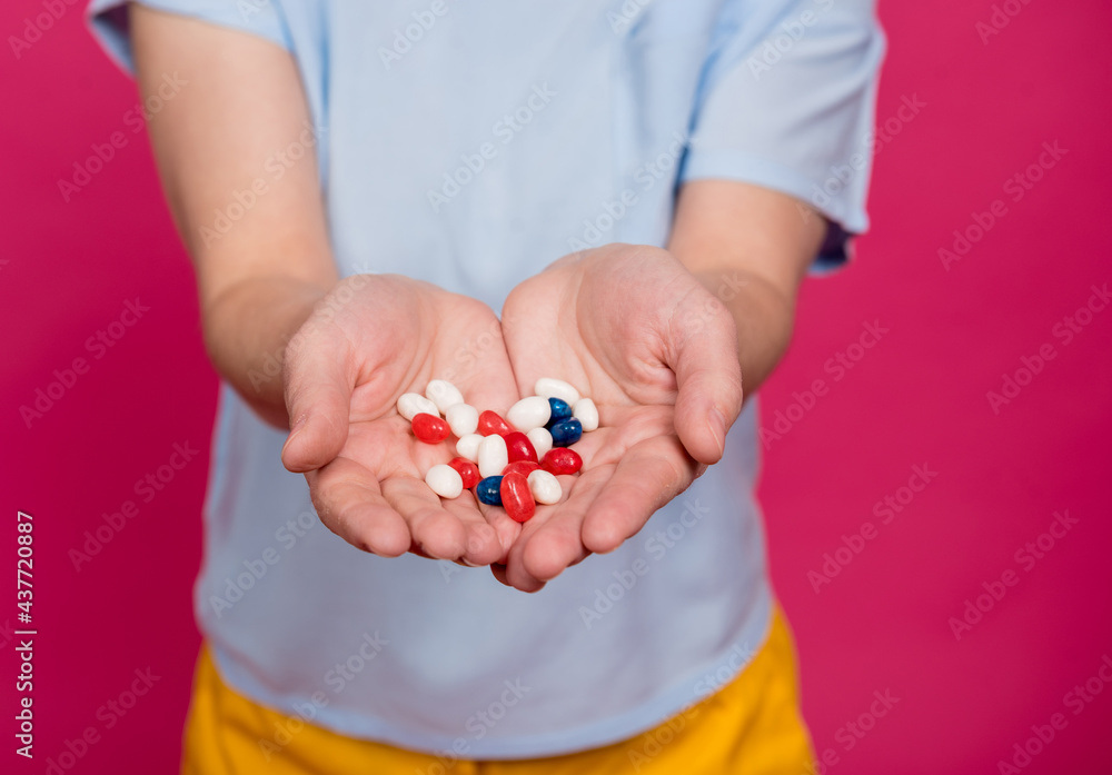 Beautiful young woman holding many pills in her hands Beautiful young woman holding many pills in her hands